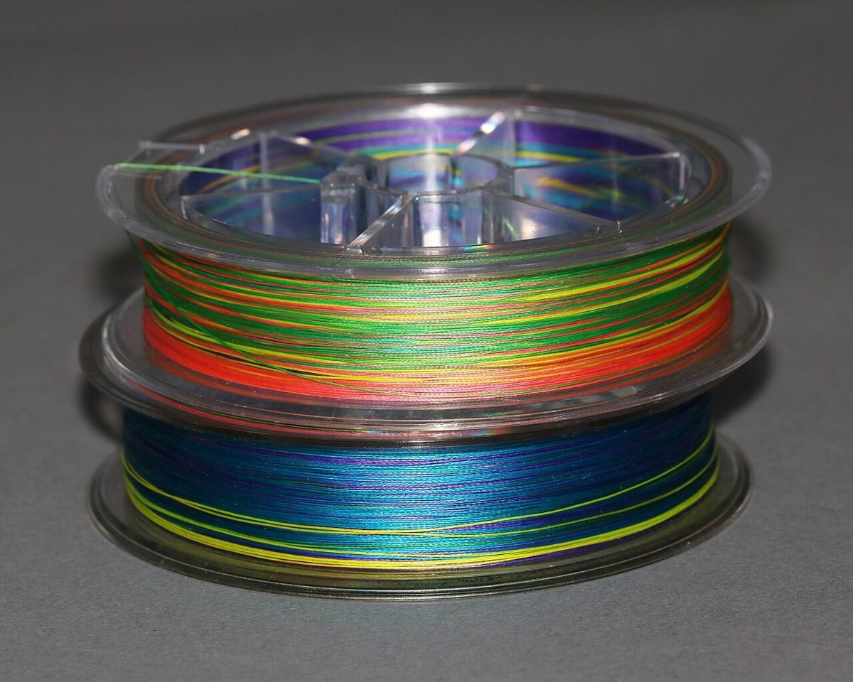 Two spools of multicolour braided fishing line