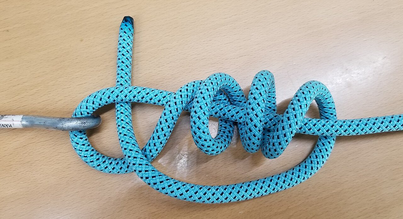 Clinch knot with its wraps around the standing line before tightening, shown in thick cord