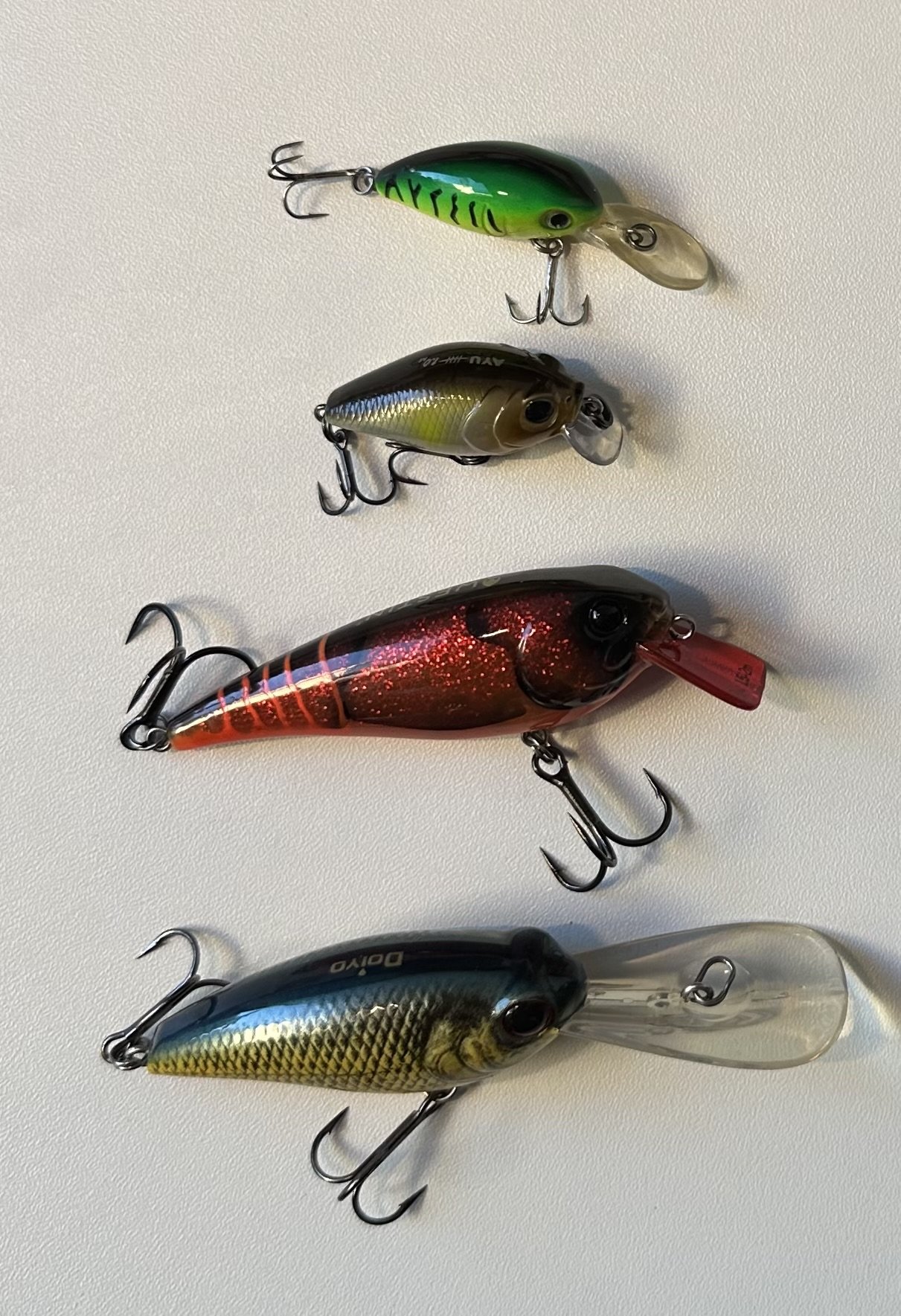 Four crankbaits with diving lips and treble hooks